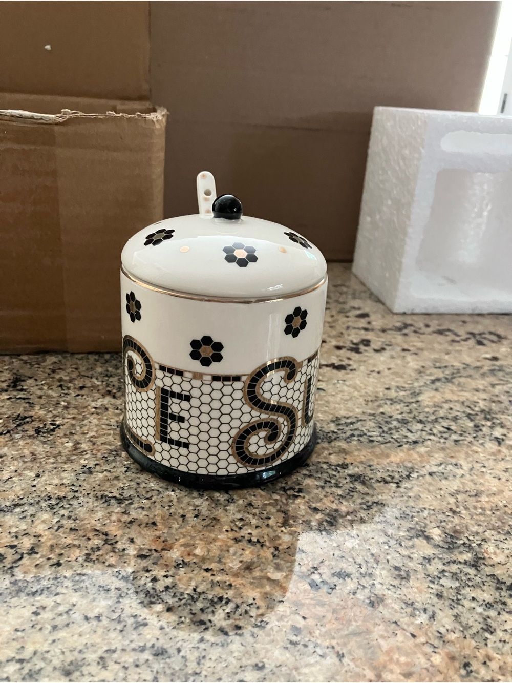 Anthropologie White Ceramic Jar with Black and Gold Floral Detailing